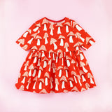 Red Mushroom Print Three Quarter Sleeve Toddler Dress on a Pink Background