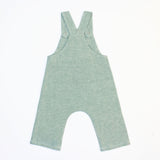 back of green linen woven overalls on white background