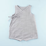 Sleeveless Wrap up Romper on a Light Blue Background