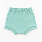 teal baby bummie shorts on a white background