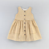 The Sunflower Dress Sewing Pattern in a Yellow Striped Fabric