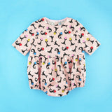 Three quarter sleeve seal romper sewing pattern on blue background