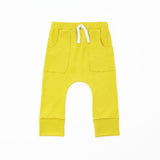mustard yellow pocket joggers on a white background