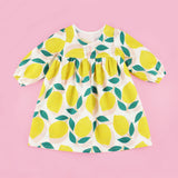 Lemonade Dress PDF Sewing Pattern on a Pink Background