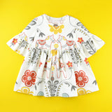 Bell Sleeve knit dress in floral dala horse fabric on yellow background