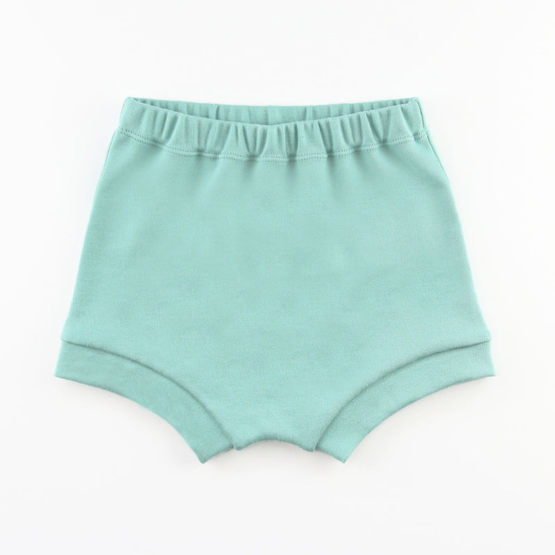 teal baby bummie shorts on a white background