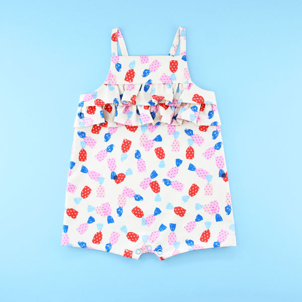 Poppy Romper Playsuit with ruffles in a strawberry candy print fabric
