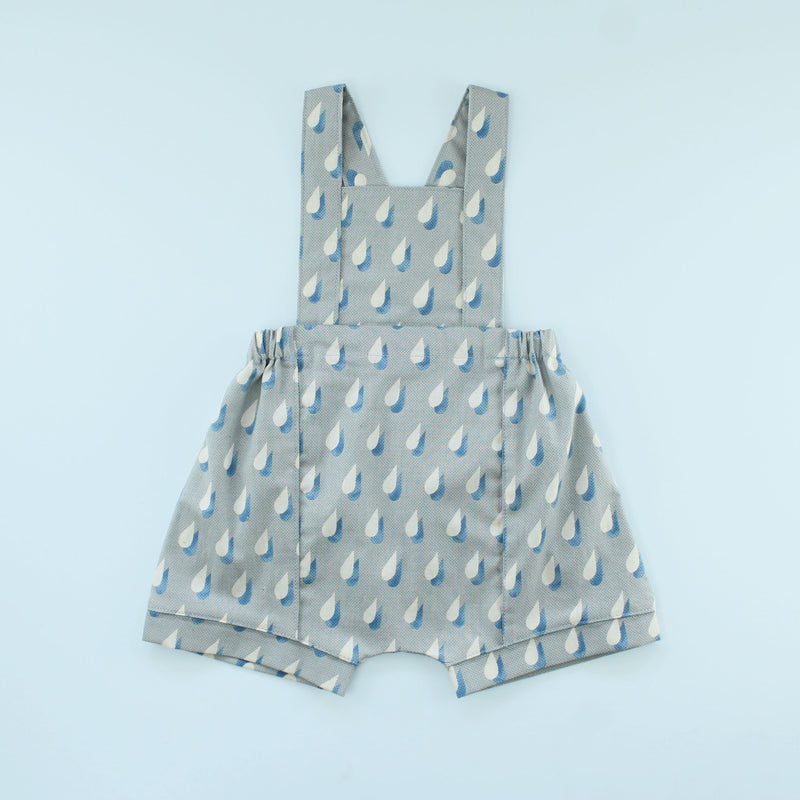 Rainy Day Romper in raindrop print on blue background