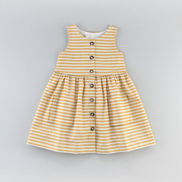 The Sunflower Dress Sewing Pattern in a Yellow Striped Fabric