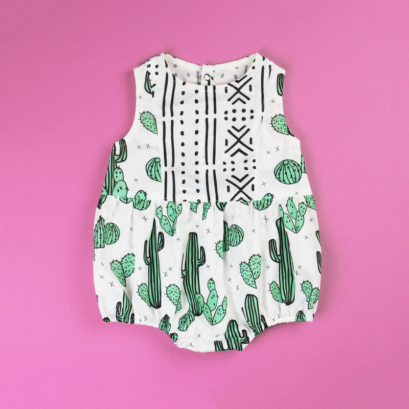 Cactus baby romper with contrast panel on fuchsia pink background