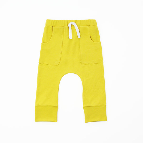 mustard yellow pocket joggers on a white background